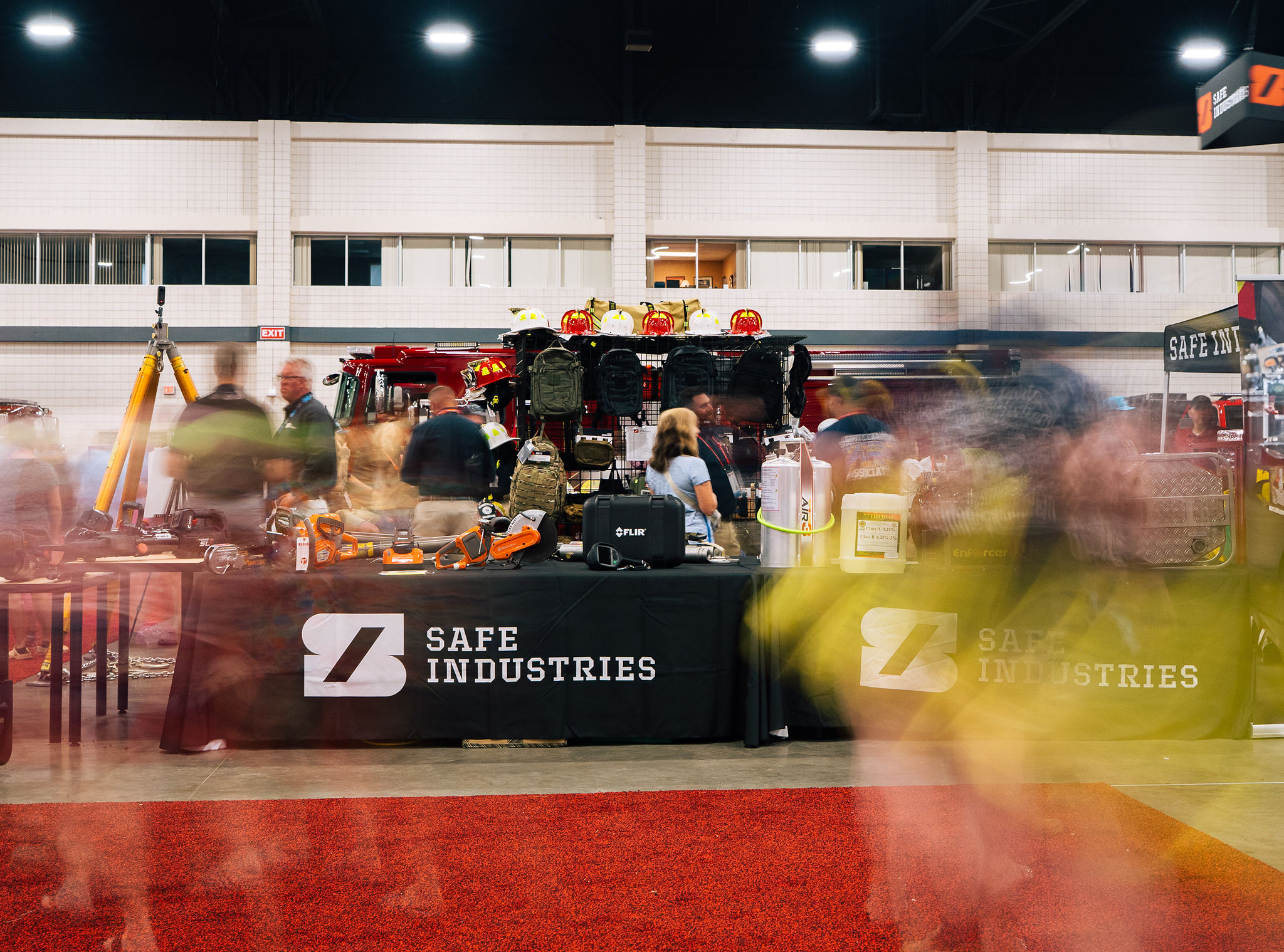 The Safe Industries booth at a fire conference, crowd moving through in long exposure